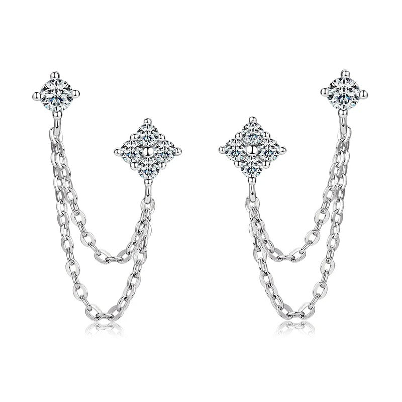 Side view of moissanite stud earrings with dangling tassel chains, highlighting the reflective silver finish and sparkling stones