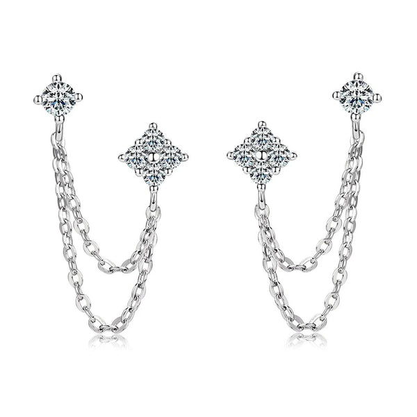 Side view of moissanite stud earrings with dangling tassel chains, highlighting the reflective silver finish and sparkling stones